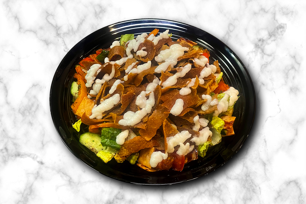 Beef Salad - Greek or fatouch topped with sliced beef donair - protein-rich Middle Eastern salad