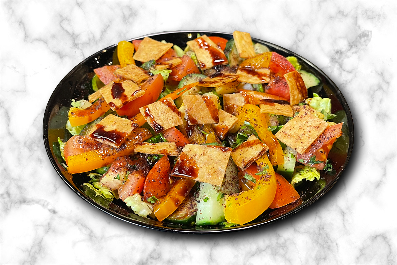 Fatouch Salad - toasted pita with fresh vegetables, sumac and lemon dressing - traditional Lebanese salad Calgary