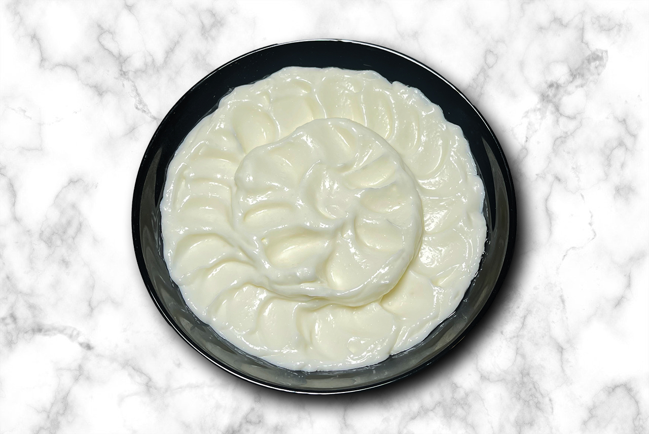 Garlic Dip - signature creamy garlic sauce - famous Lebanese toum at Shawarma Barlow Calgary