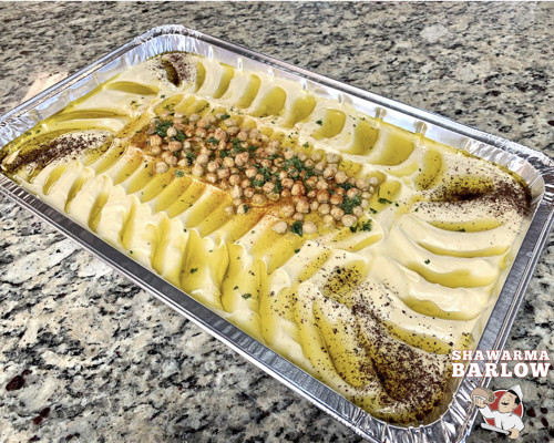 A tray of creamy smooth Hummus
